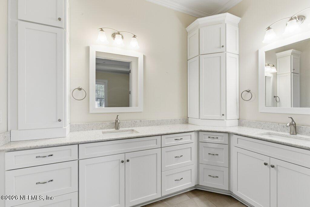 569 Timber Bridge Lane Atlantic Beach, FL 32233 - Photo 35 of 81 a bathroom with a sink and mirror
