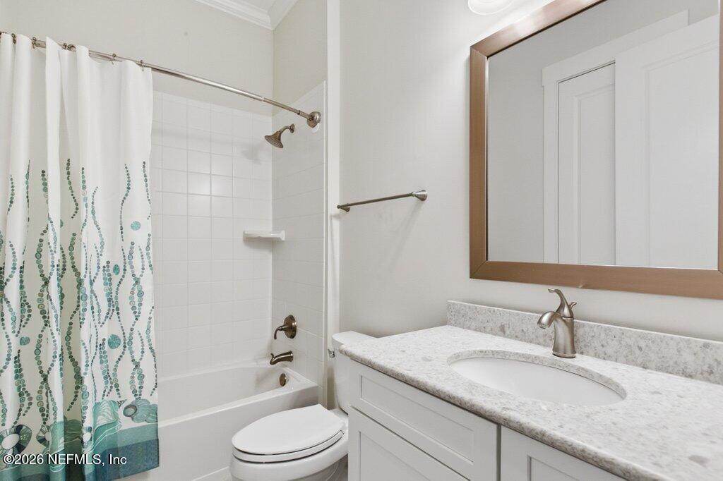 569 Timber Bridge Lane Atlantic Beach, FL 32233 - Photo 42 of 81 a bathroom with a granite countertop sink toilet and shower