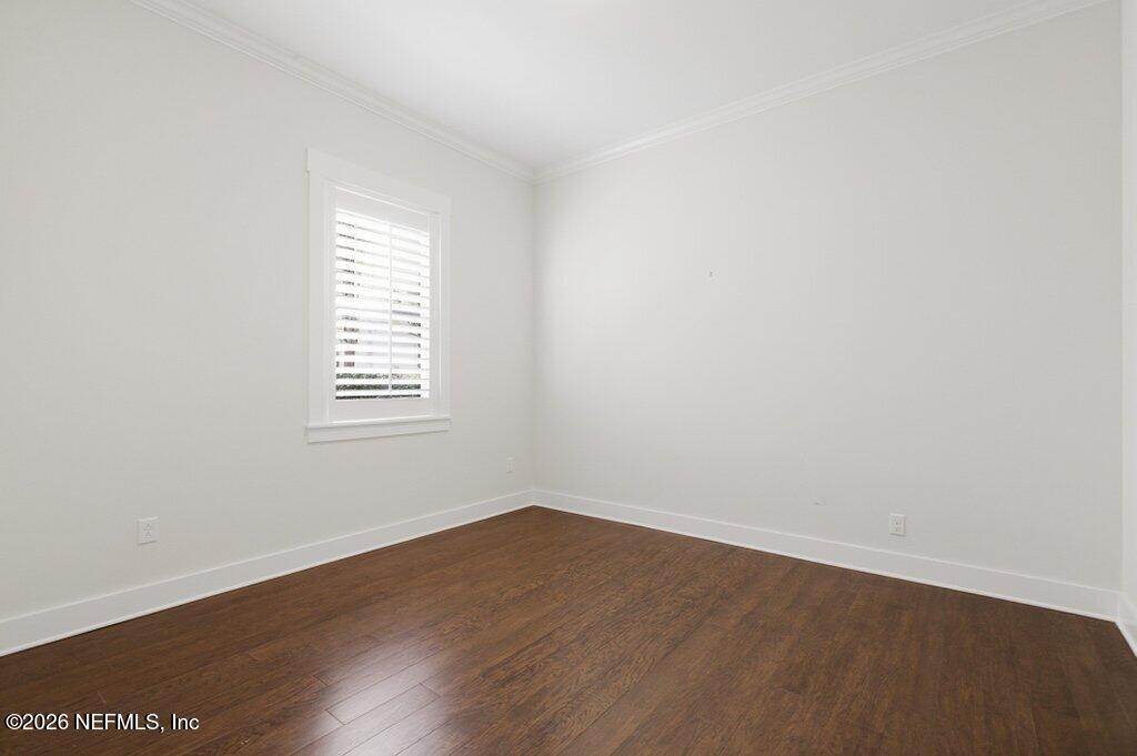 569 Timber Bridge Lane Atlantic Beach, FL 32233 - Photo 43 of 81 an empty room with wooden floor and windows