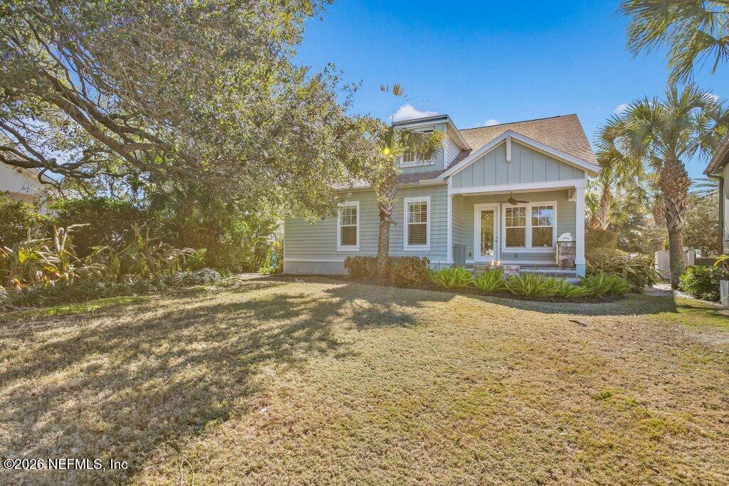 569 Timber Bridge Lane Atlantic Beach, FL 32233 - Photo 65 of 81 a front view of a house with a yard