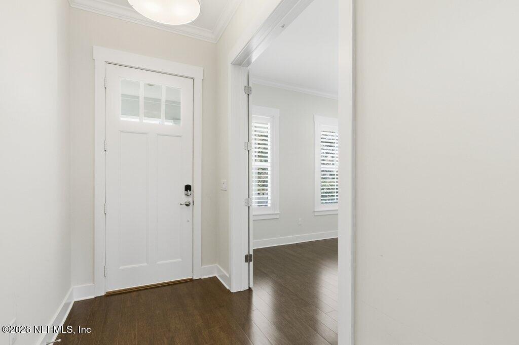569 Timber Bridge Lane Atlantic Beach, FL 32233 - Photo 9 of 81 a view of an empty room with wooden floor and a window