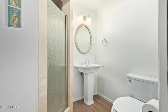 a utility room with sink dryer and washer