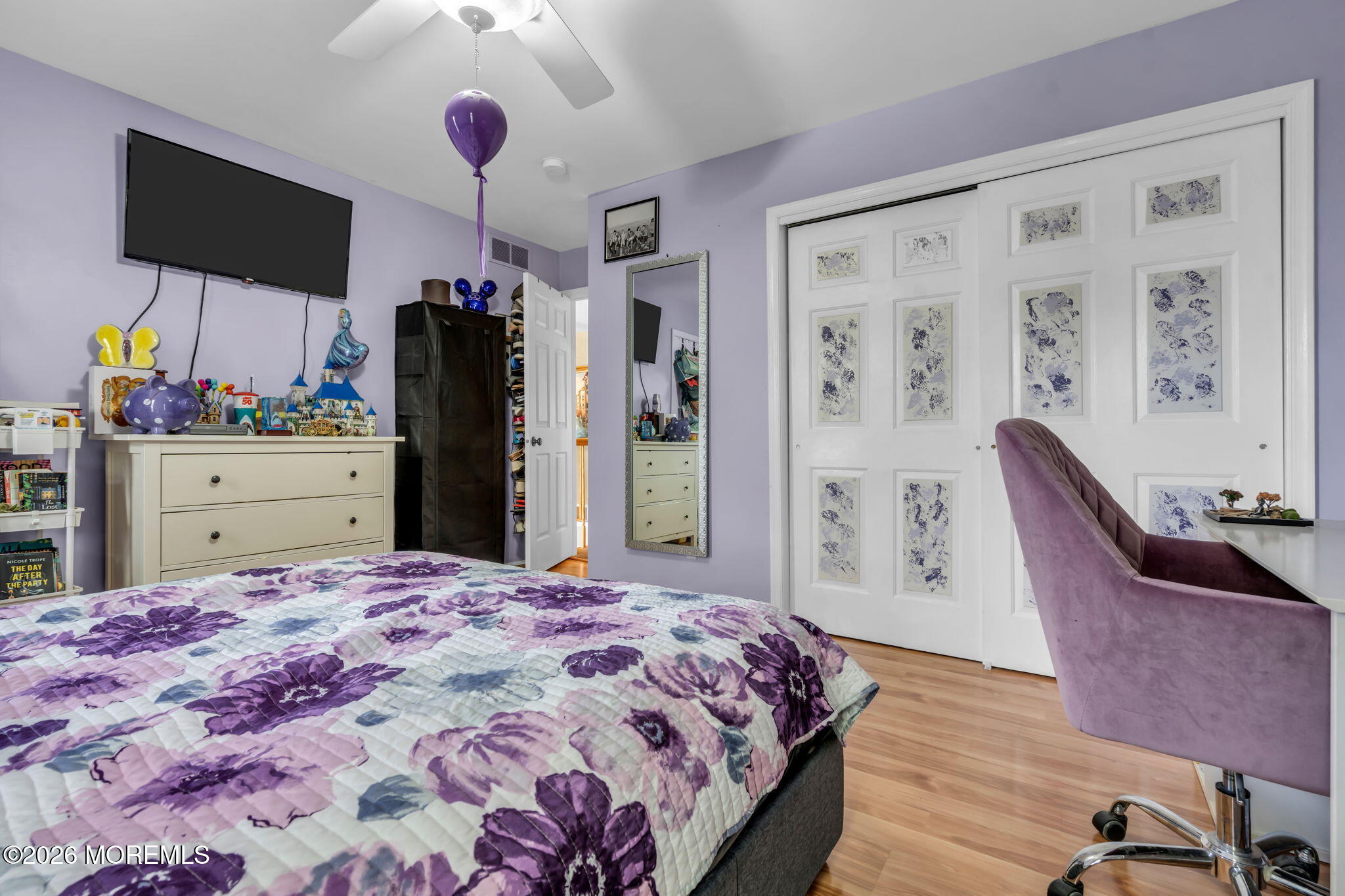 21 Ryan Road Marlboro, NJ 07746 - Photo 28 of 56 a bedroom with a bed and flat screen tv