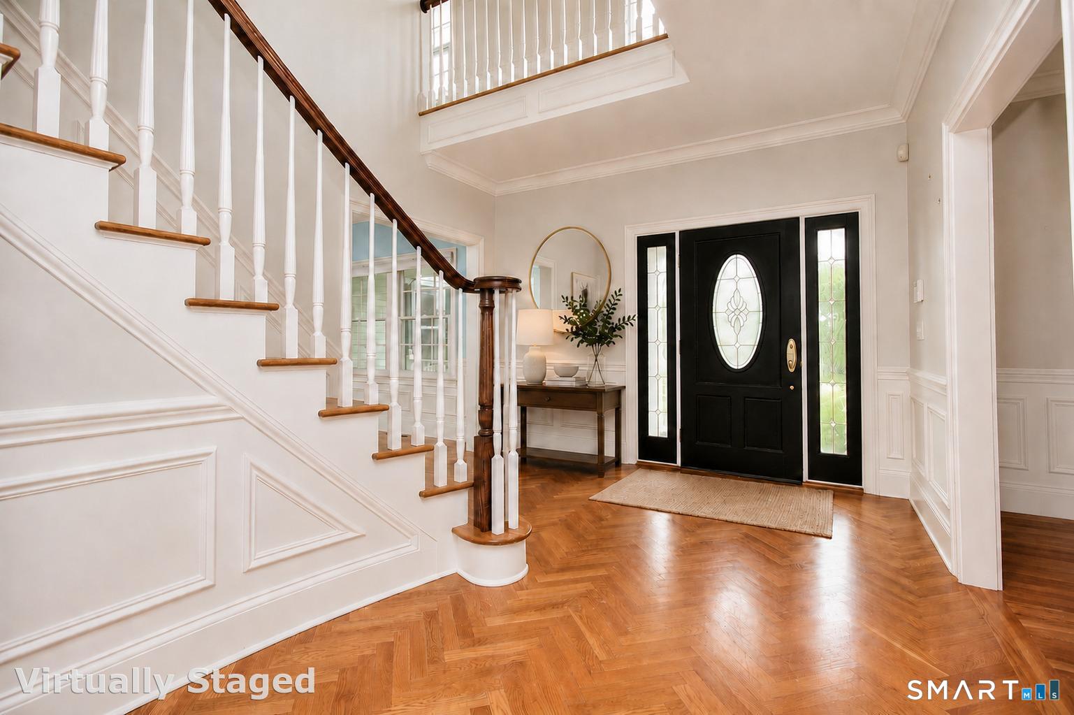 Dramatic entry to this beautiful one-of-a-kind home