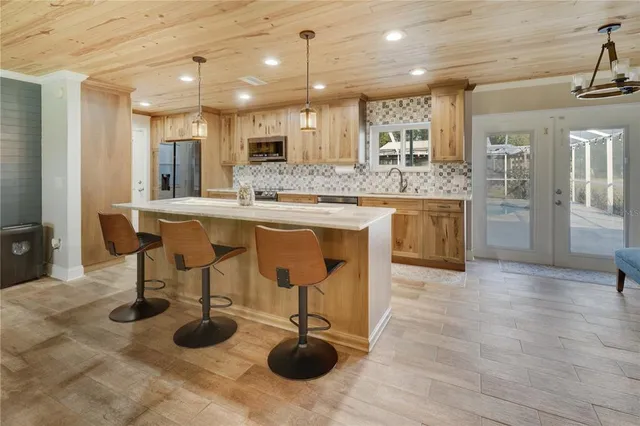 a kitchen with stove and cabinets