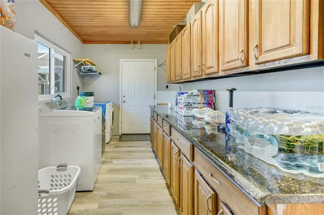 a bathroom with a shower sink and mirror