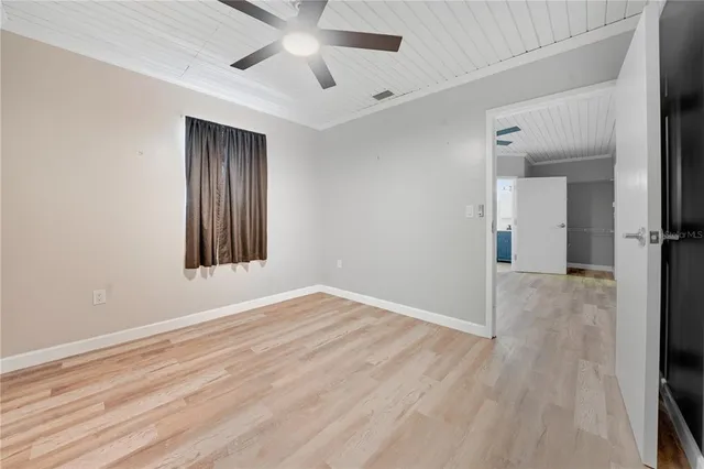 a bed room with a bed and a desk