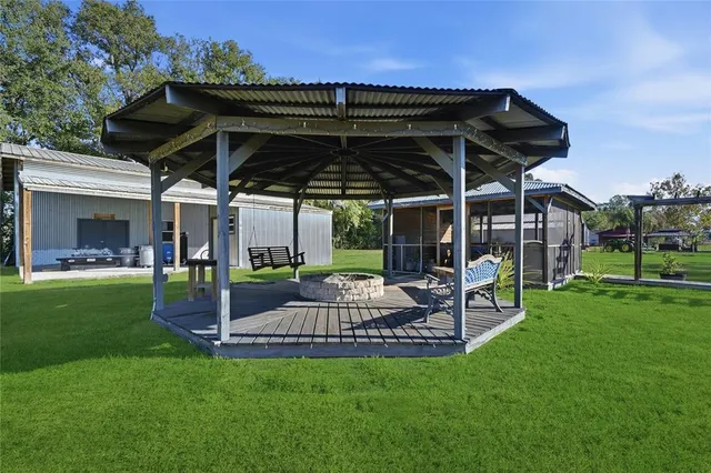 a view of a backyard with a large tree