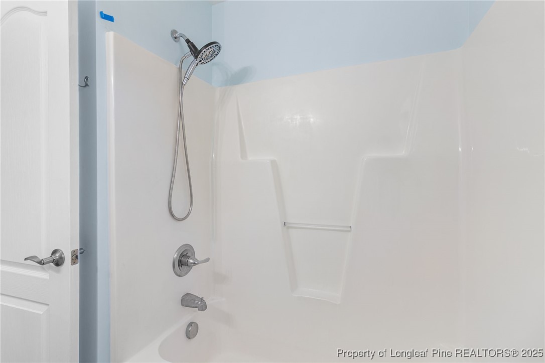 64 Humvee Court Broadway, NC 27505 - Photo 22 of 38 a bathroom with a shower