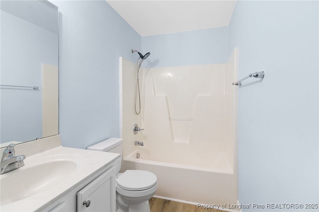 64 Humvee Court Broadway, NC 27505 - Photo 27 of 38 a bathroom with a sink a toilet and shower