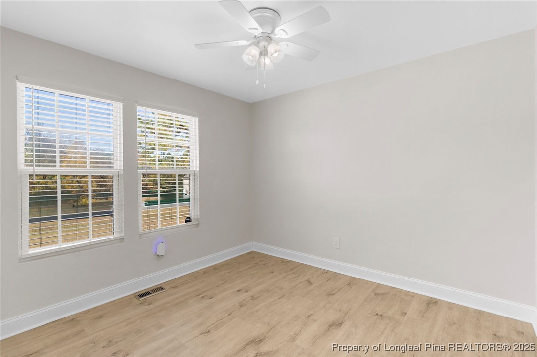 64 Humvee Court Broadway, NC 27505 - Photo 29 of 38 an empty room with a window and a fan