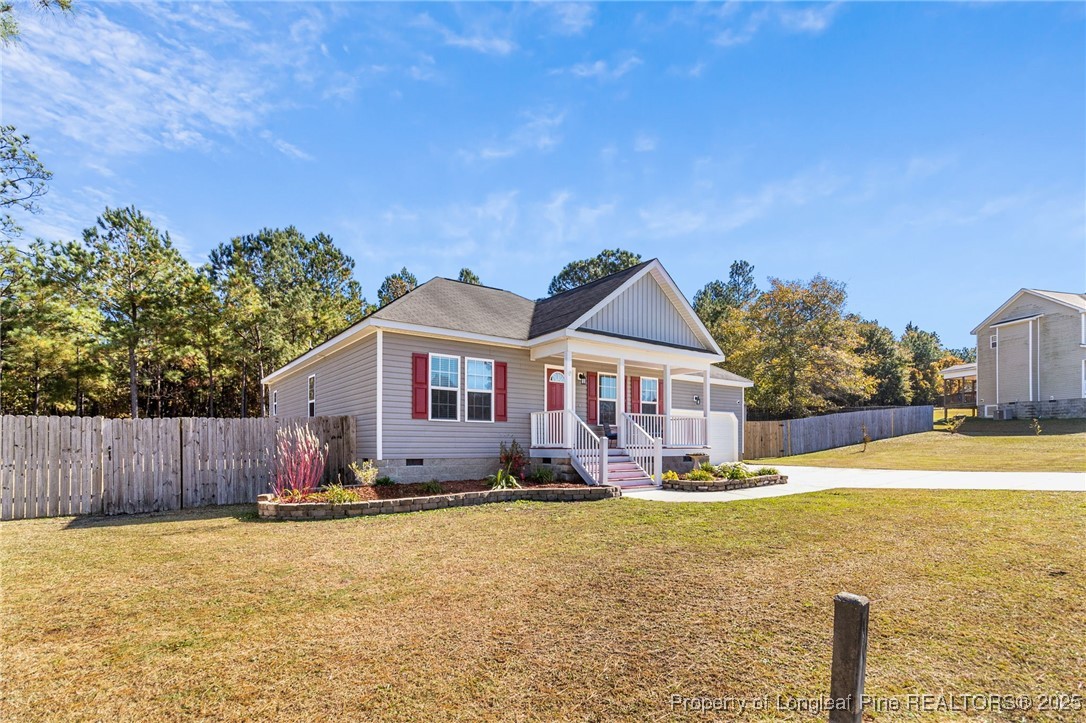 64 Humvee Court Broadway, NC 27505 - Photo 3 of 38 a front view of a house with a yard