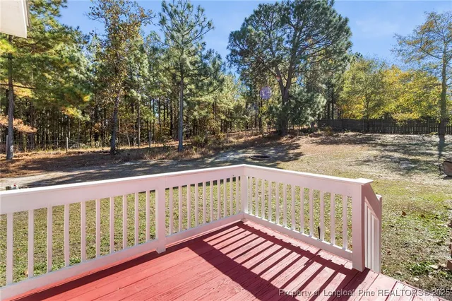 a view of deck with wooden floor and fence