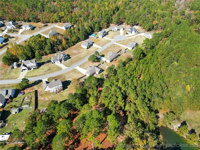 a view of a garden with a table and chairs