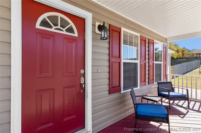 a view of living room with furniture and wooden floor