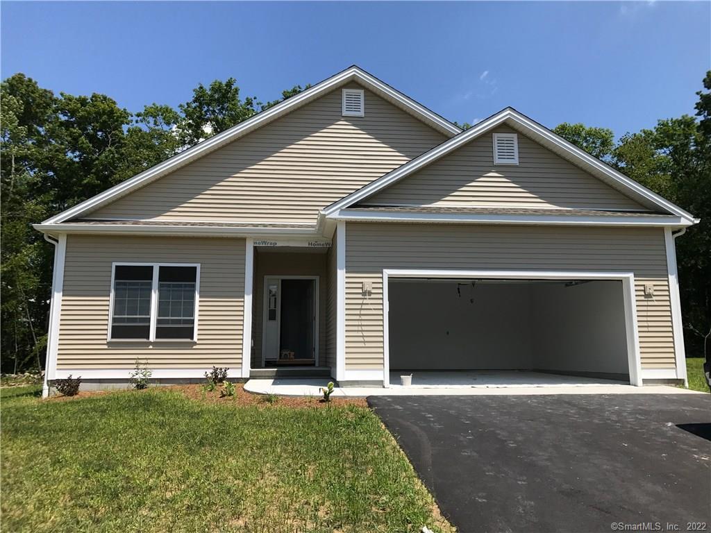 4 Grouse Court, Unit 4 Killingly, CT 06239 - Photo 1 of 1 a front view of a house with garage
