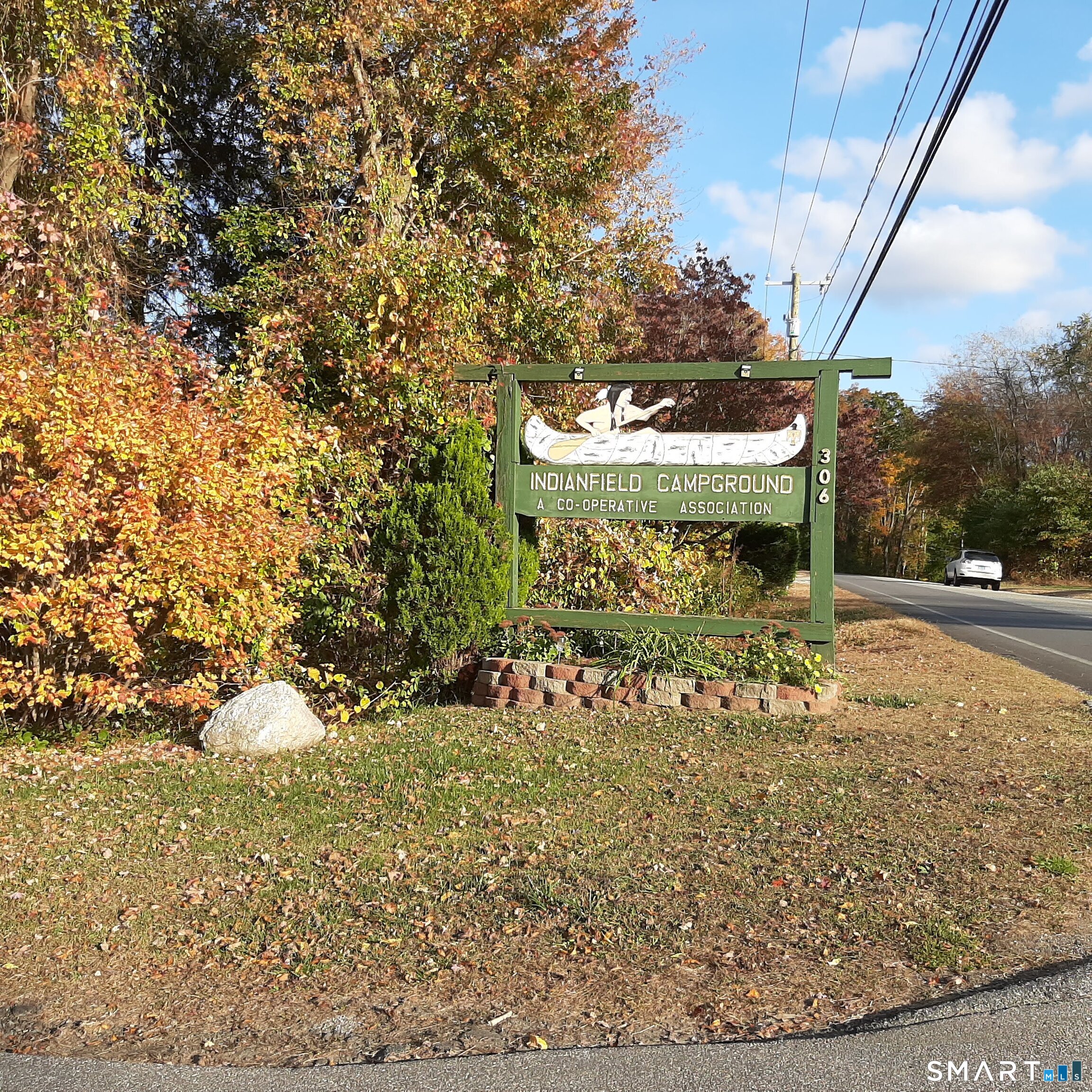 306 Old Colchester Road, Unit 126 Salem, CT 06420 - Photo 13 of 22 a view of a water fountain with large trees