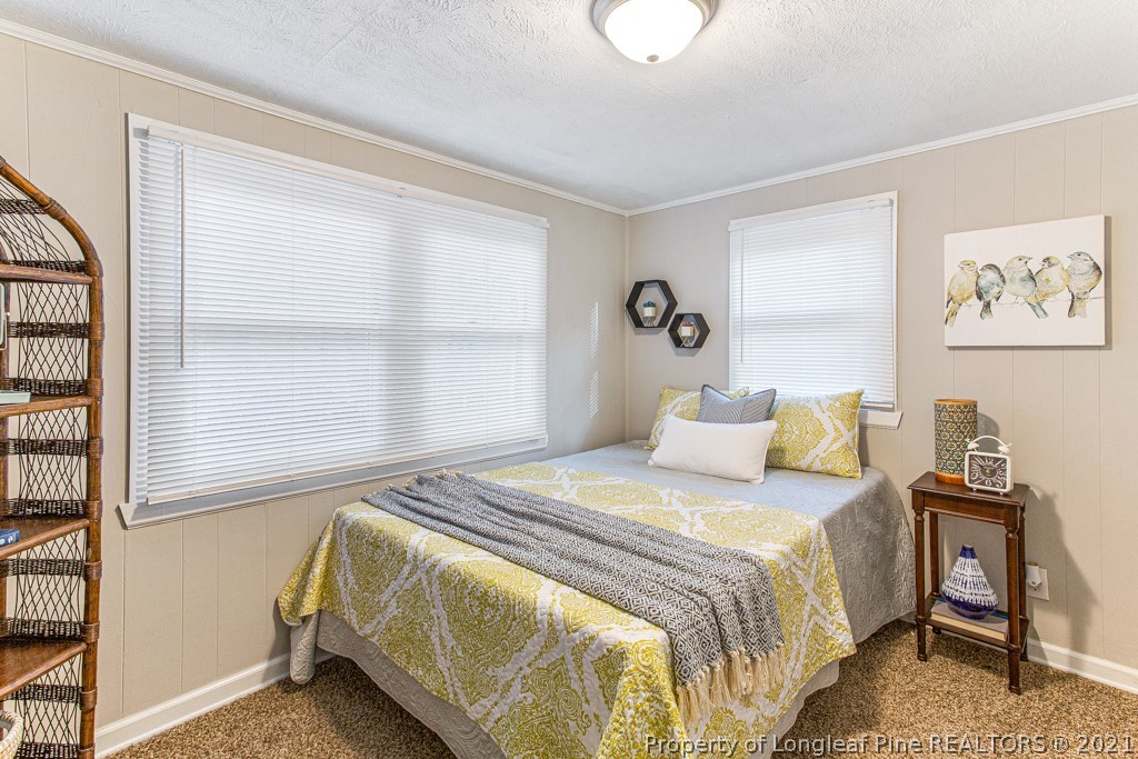 227 H T Kelly Road Cameron, NC 28326 - Photo 18 of 29 a bedroom with a bed and a window