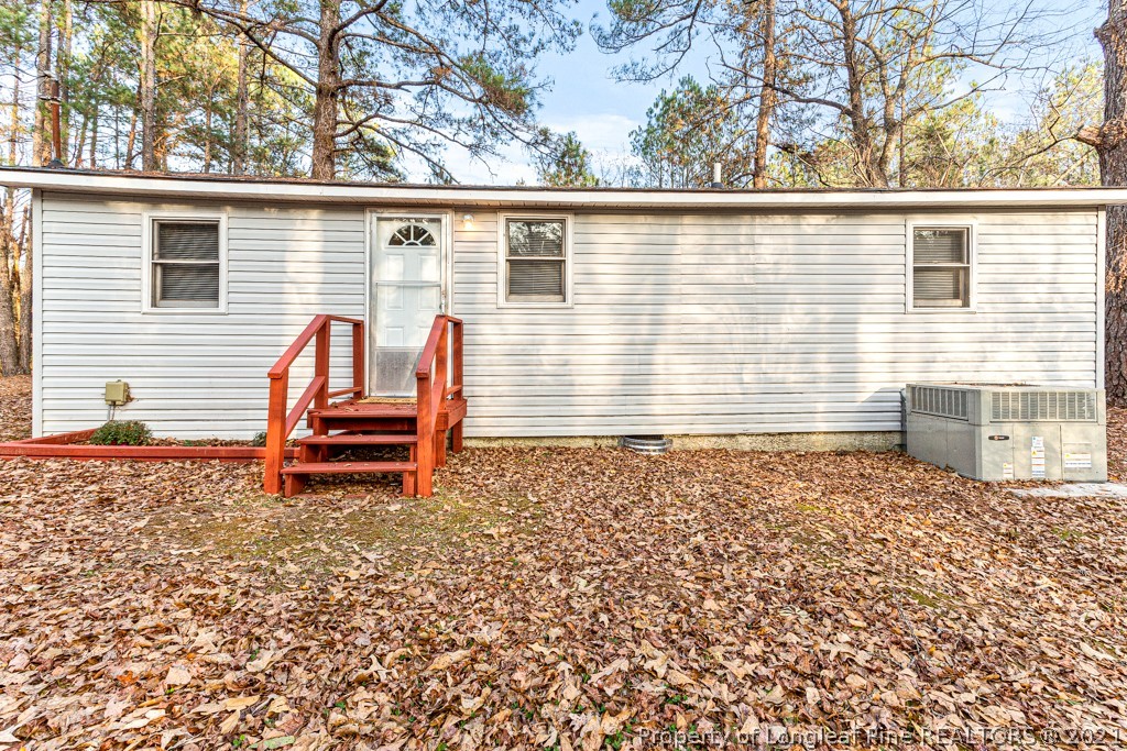 227 H T Kelly Road Cameron, NC 28326 - Photo 25 of 29 a view of a back yard of the house with wooden fence
