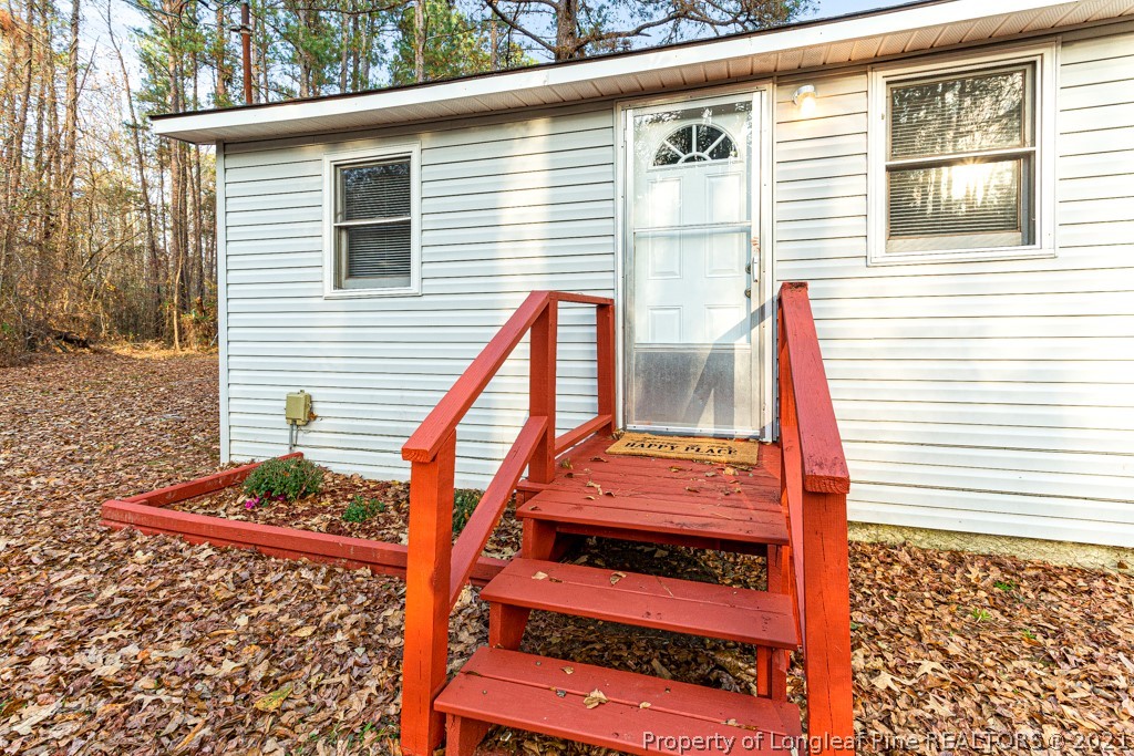 227 H T Kelly Road Cameron, NC 28326 - Photo 26 of 29 a front view of a house with a garage