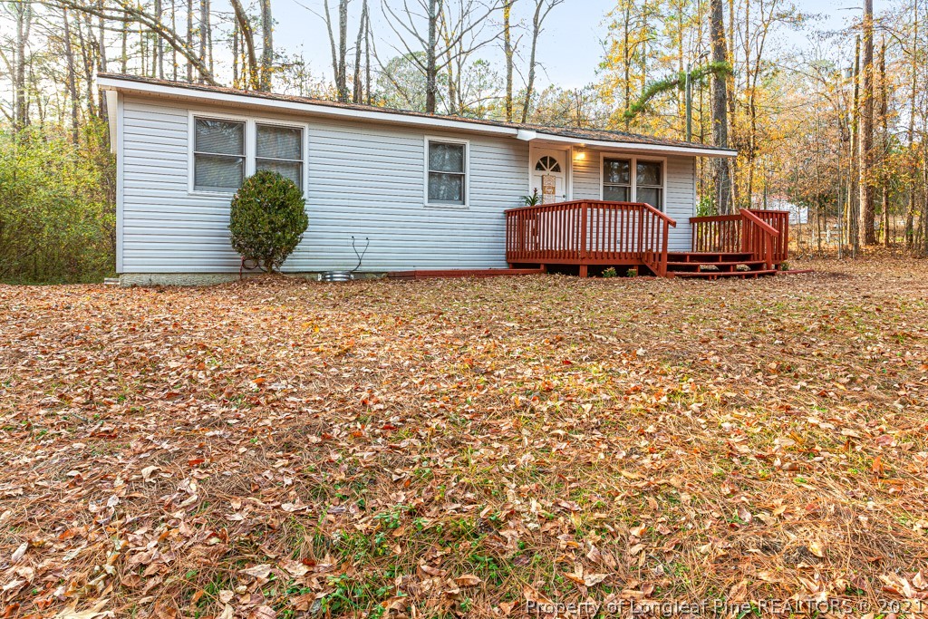 227 H T Kelly Road Cameron, NC 28326 - Photo 3 of 29 a view of a house with a backyard