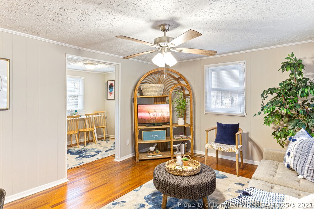 227 H T Kelly Road Cameron, NC 28326 - Photo 8 of 29 a living room with a table and chairs
