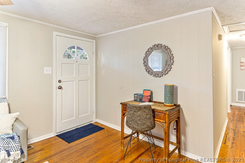 227 H T Kelly Road Cameron, NC 28326 - Photo 9 of 29 a view of a room that has a table and chair in it