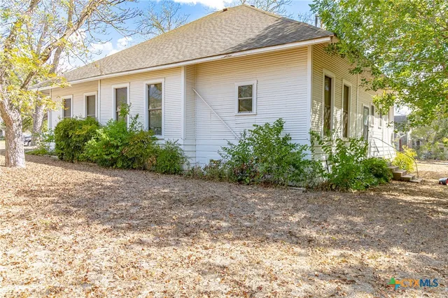 a view of a garage with a table and chairs