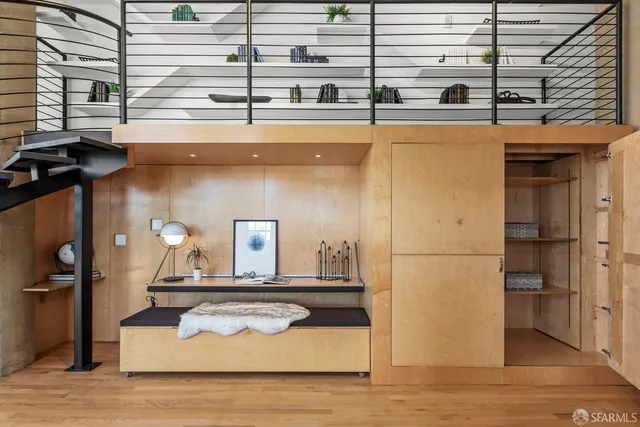 a kitchen with a refrigerator and a table