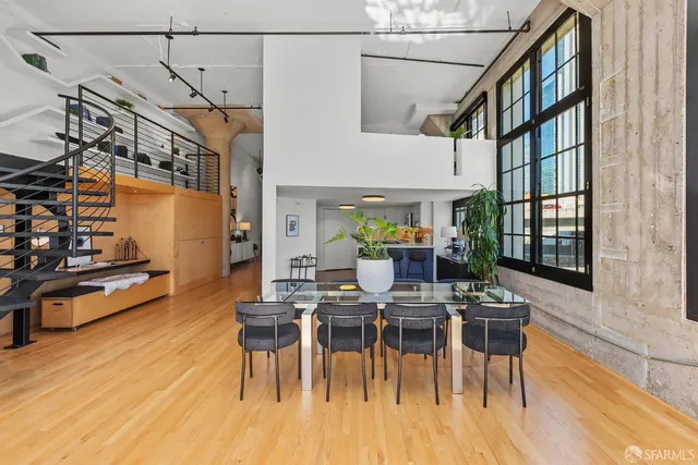 a view of a patio with dining table and chairs