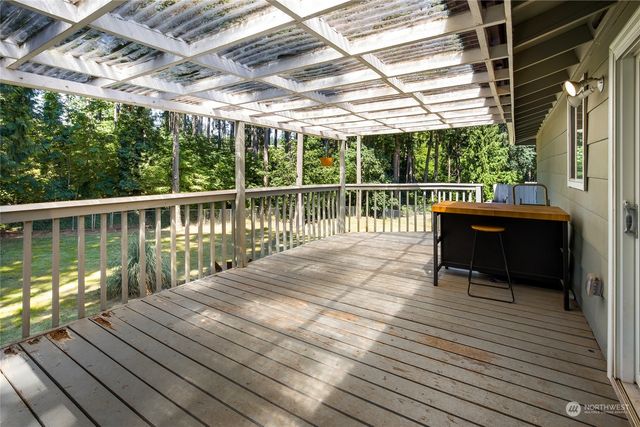 a balcony with wooden floor