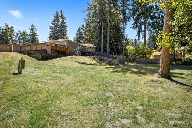 a front view of house with outdoor seating