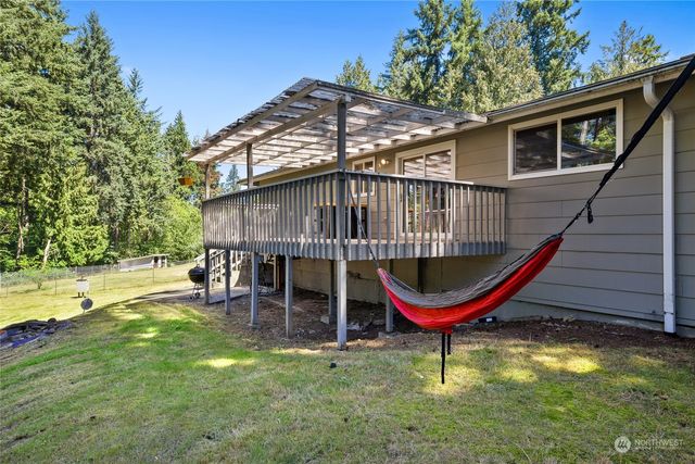 an aerial view of residential house with outdoor space and swimming pool