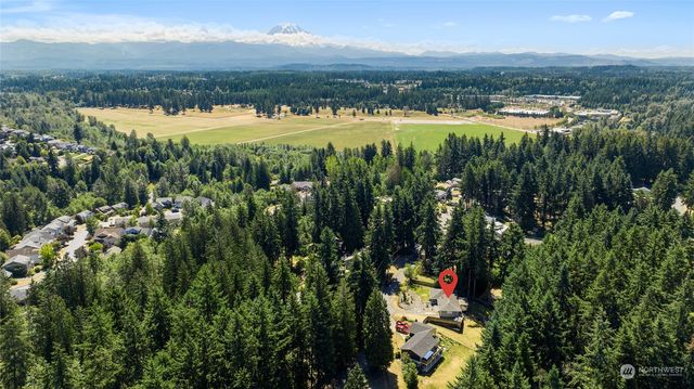 a view of a house with a balcony and chair