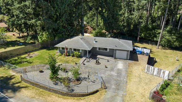 a view of a terrace with a table and chairs