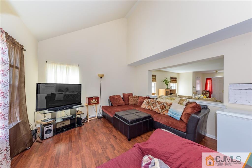 6 Yorkshire Village Road Lawrence Township, NJ 08648 - Photo 13 of 30 a living room with furniture and a flat screen tv
