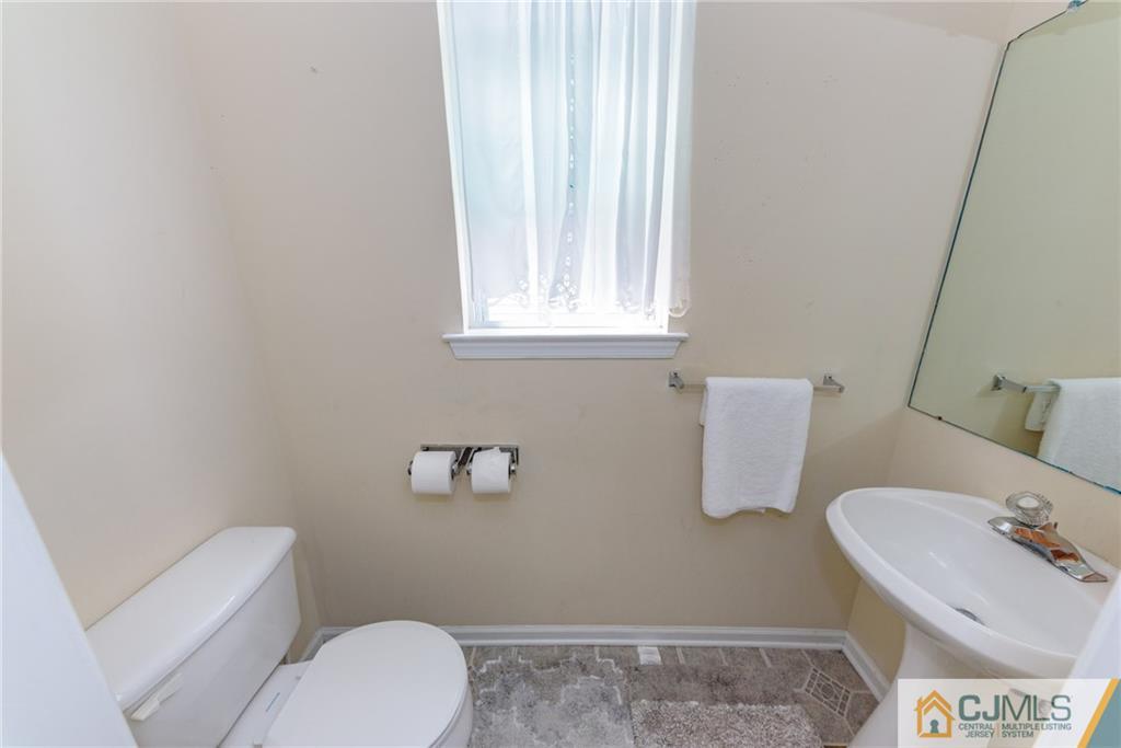 6 Yorkshire Village Road Lawrence Township, NJ 08648 - Photo 14 of 30 a bathroom with a sink and a toilet