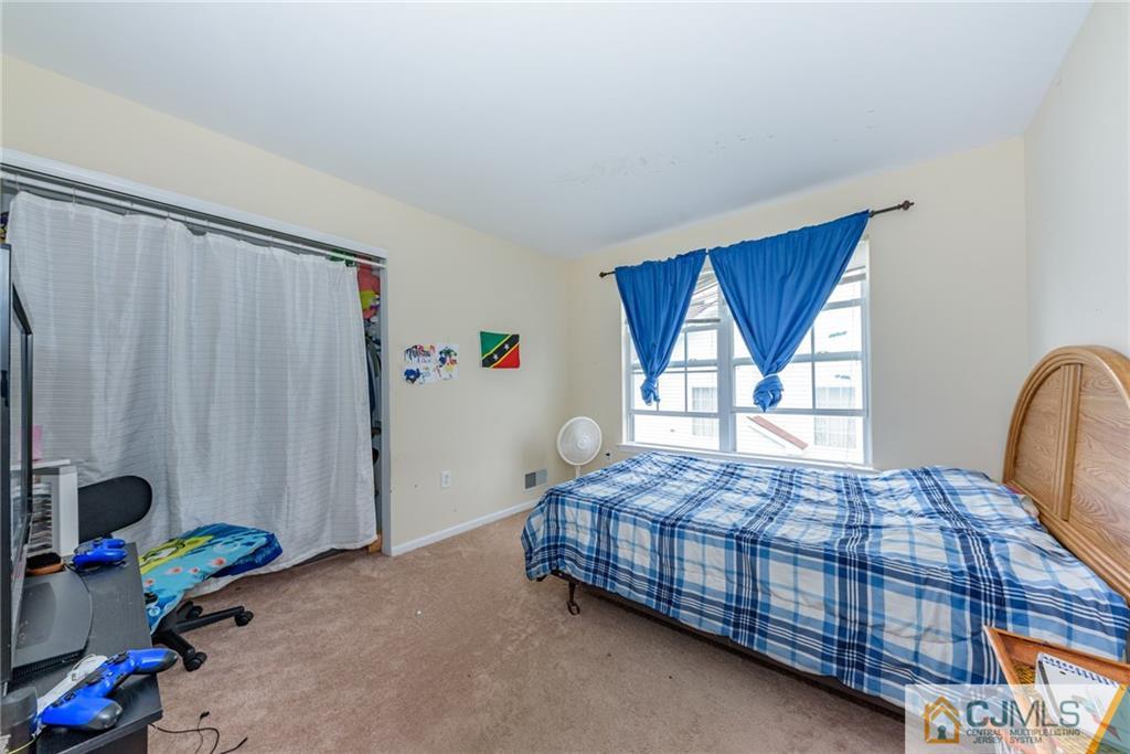 6 Yorkshire Village Road Lawrence Township, NJ 08648 - Photo 17 of 30 a bedroom with a bed and a window