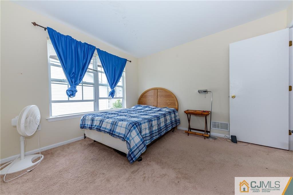 6 Yorkshire Village Road Lawrence Township, NJ 08648 - Photo 18 of 30 a bedroom with a bed and window