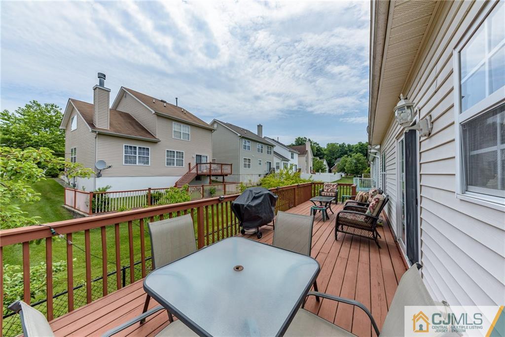 6 Yorkshire Village Road Lawrence Township, NJ 08648 - Photo 28 of 30 a view of a patio with couches table and chairs and wooden floor