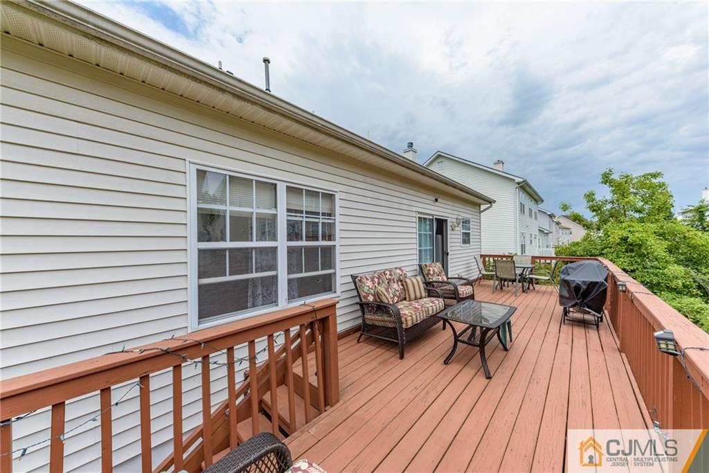 6 Yorkshire Village Road Lawrence Township, NJ 08648 - Photo 29 of 30 a balcony with furniture and wooden floor