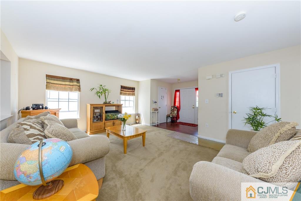 6 Yorkshire Village Road Lawrence Township, NJ 08648 - Photo 4 of 30 a living room with furniture and a wooden floor