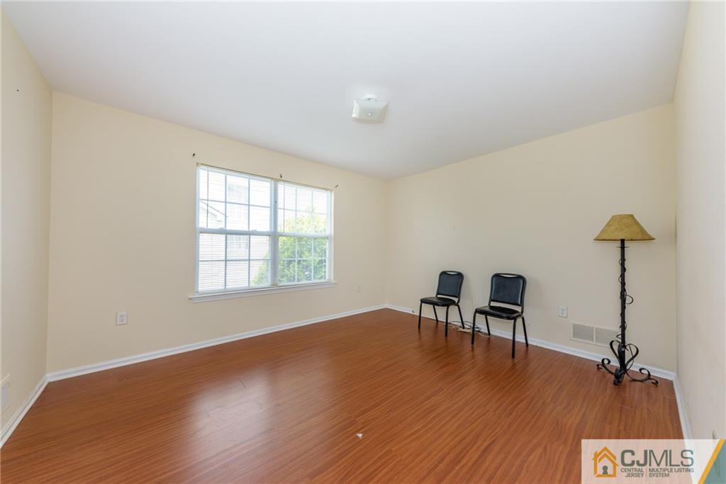 6 Yorkshire Village Road Lawrence Township, NJ 08648 - Photo 7 of 30 a view of a room with wooden floor and a window