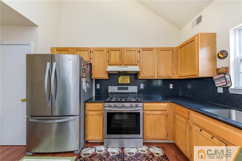 6 Yorkshire Village Road Lawrence Township, NJ 08648 - Photo 8 of 30 a kitchen with a refrigerator and a stove