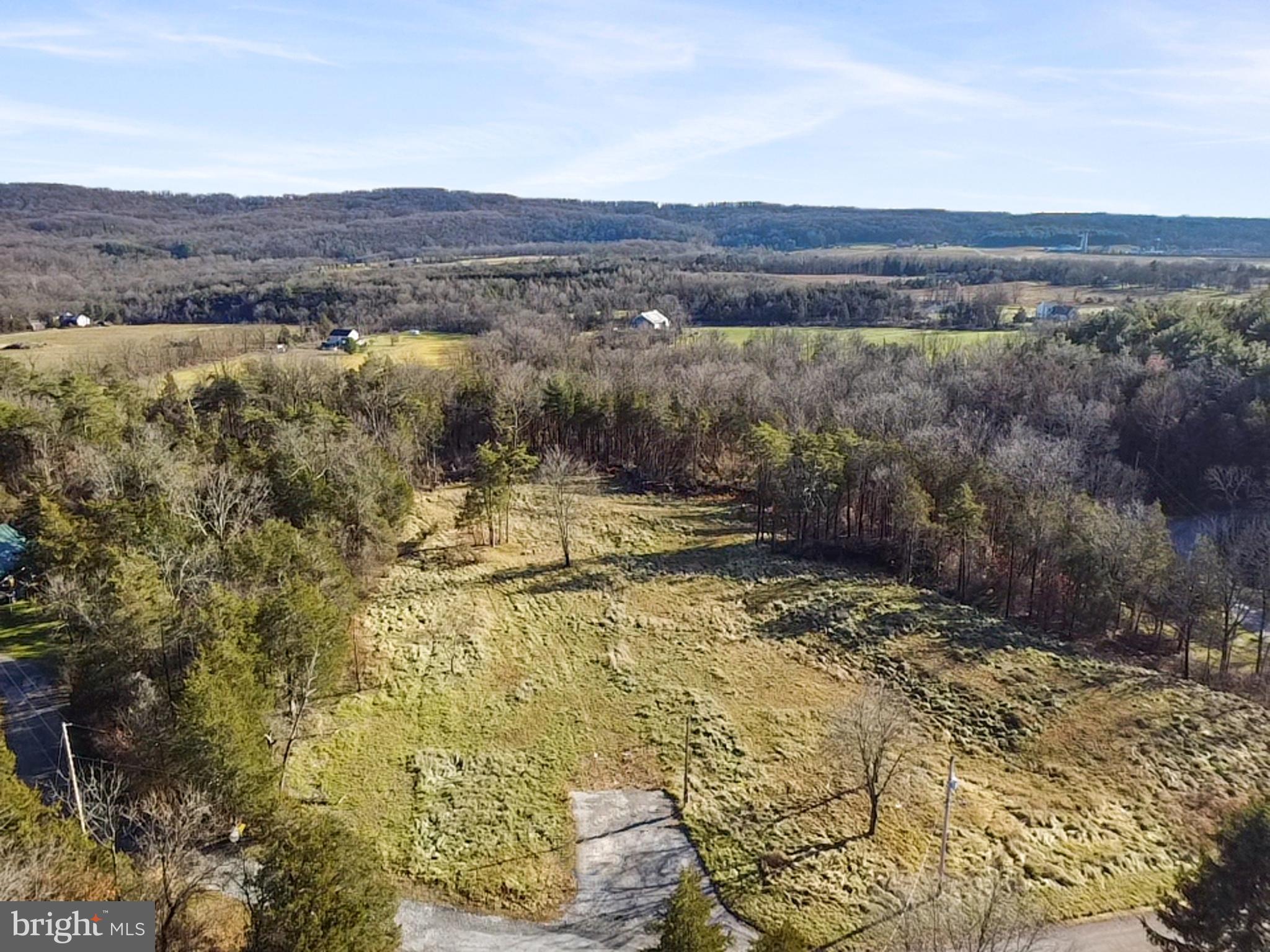 245 Bumble Bee Hollow Road Wellsville, PA 17365 - Photo 8 of 25 a view of a lake with mountains in the background