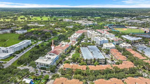 an aerial view of residential houses with outdoor space and river