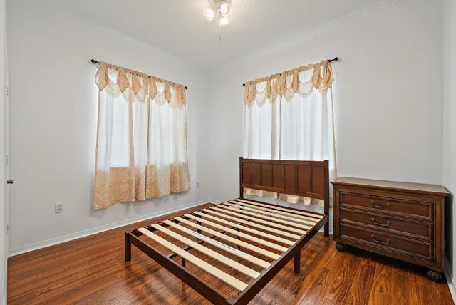 a view of wooden floor and bedroom in a room