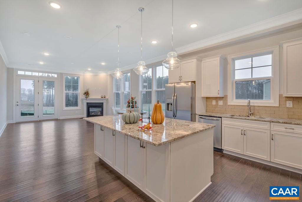 352 Claibourne Road Crozet, VA 22932 - Photo 15 of 28 a large kitchen with stainless steel appliances granite countertop a large center island attached withe living room