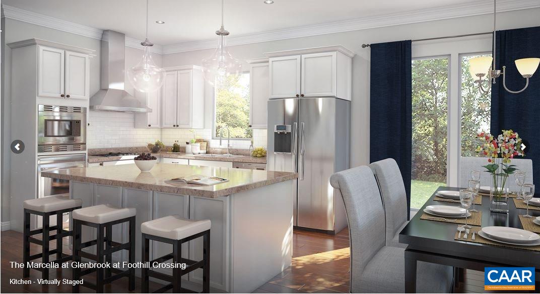 352 Claibourne Road Crozet, VA 22932 - Photo 5 of 28 a kitchen with stainless steel appliances a dining table chairs refrigerator and sink