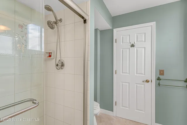 a bedroom with a bed and a table in it